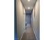 Neutral hallway with carpet floors, recessed lighting and window at 10280 Midnight Meteor Ave, Las Vegas, NV 89166