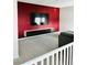 Bright living room features a modern entertainment center and red accent wall, offering style and comfort at 10280 Midnight Meteor Ave, Las Vegas, NV 89166