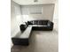 Inviting living room features a large sectional sofa for comfortable seating and relaxation at 10280 Midnight Meteor Ave, Las Vegas, NV 89166