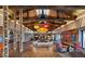 Spacious lobby showcasing high ceilings with wood beams, designer lighting, and comfortable seating at 10280 Midnight Meteor Ave, Las Vegas, NV 89166