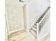 Staircase features gray carpet, modern wood trim, and light wood floors at 10280 Midnight Meteor Ave, Las Vegas, NV 89166
