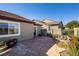 Backyard view featuring a custom waterfall, hardscape, desert landscaping, and partial mountain views at 10336 Birch Bluff Ln, Las Vegas, NV 89145