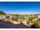 An elevated deck and patio provide unobstructed views of mountains and desert landscape at 10336 Birch Bluff Ln, Las Vegas, NV 89145