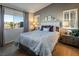Charming bedroom showcasing a queen-size bed, plush carpeting, ample natural light, and stylish decor at 10336 Birch Bluff Ln, Las Vegas, NV 89145