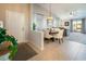 Open concept dining area featuring a round table, chandelier, and seamless access to the living room at 10336 Birch Bluff Ln, Las Vegas, NV 89145