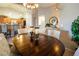 Cozy dining area showcasing a wooden table, chandelier, and an open layout at 10336 Birch Bluff Ln, Las Vegas, NV 89145