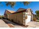 Charming single-story home with a well-maintained lawn, walkway, and attached two-car garage at 10336 Birch Bluff Ln, Las Vegas, NV 89145