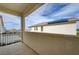 An outdoor balcony with a view of neighboring homes and a roof with solar panels at 10512 Mann St, Las Vegas, NV 89141