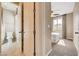 This bathroom features a toilet and shower/tub combo with decorative tile and fixtures at 10512 Mann St, Las Vegas, NV 89141