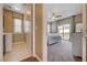 View from the hallway to the bedroom with a double door entrance to the laundry room with a washer and dryer at 10512 Mann St, Las Vegas, NV 89141