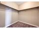 Walk-in closet with carpeted floors and hanging rods at 10512 Mann St, Las Vegas, NV 89141