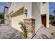 Beautiful home exterior featuring stone accents, a paved driveway, and a welcoming entryway at 10512 Mann St, Las Vegas, NV 89141