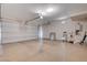 Two car garage with epoxy floor, garage door, and water heater at 10512 Mann St, Las Vegas, NV 89141