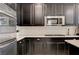 Detailed kitchen shot showcases stainless steel appliances and stylish backsplash at 10512 Mann St, Las Vegas, NV 89141