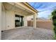 Stylish covered patio featuring pavers, gravel, and string lights, creating an inviting outdoor living area at 10512 Mann St, Las Vegas, NV 89141