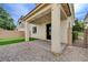 Cozy covered patio with string lights, offering a relaxing outdoor space with pavers, gravel, and turf at 10512 Mann St, Las Vegas, NV 89141