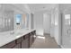 Bathroom view with a double sink vanity with chrome fixtures and tiled floors at 11407 Ethereal Landing Ave, Las Vegas, NV 89138