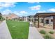 Charming community featuring landscaped green spaces, modern architecture, and mountain views at 11407 Ethereal Landing Ave, Las Vegas, NV 89138