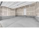 Spacious two-car garage featuring bare drywall and concrete flooring, ideal for storage or workshop space at 11407 Ethereal Landing Ave, Las Vegas, NV 89138
