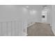 Upstairs carpeted hallway featuring white railings at 11407 Ethereal Landing Ave, Las Vegas, NV 89138