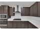 Modern kitchen features stainless steel appliances and dark cabinets at 11407 Ethereal Landing Ave, Las Vegas, NV 89138