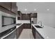 Stylish kitchen boasts stainless appliances, gas cooktop, plenty of cabinets, and center island at 11407 Ethereal Landing Ave, Las Vegas, NV 89138