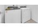 Laundry room featuring a white Whirlpool washer and dryer at 11407 Ethereal Landing Ave, Las Vegas, NV 89138