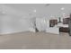 The living space features tile floors, recessed lighting, and seamless transition into the modern kitchen at 11407 Ethereal Landing Ave, Las Vegas, NV 89138