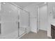 Modern shower with glass enclosure and a built-in bench, creating a spa-like experience at 11407 Ethereal Landing Ave, Las Vegas, NV 89138