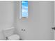 Bright toilet room features modern toilet and small window, providing practicality and comfort at 11407 Ethereal Landing Ave, Las Vegas, NV 89138