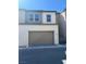 Contemporary home with two-car garage and neutral color palette at 11423 Ethereal Landing Ave, Las Vegas, NV 89138