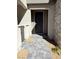 Inviting entryway with a gray paver pathway leading to a solid gray front door and stone veneer accents at 11423 Ethereal Landing Ave, Las Vegas, NV 89138