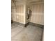 View of garage with concrete floor and utility installations on unfinished walls at 11423 Ethereal Landing Ave, Las Vegas, NV 89138