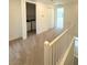Upstairs hallway with laundry closet, storage and bedrooms at 11423 Ethereal Landing Ave, Las Vegas, NV 89138