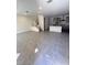 Open-concept living space featuring tile floors and stairs leading to the upper level, seamlessly connecting living areas at 11423 Ethereal Landing Ave, Las Vegas, NV 89138