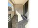Charming covered patio featuring gray pavers, stucco walls, and a sliding door for indoor/outdoor living at 11423 Ethereal Landing Ave, Las Vegas, NV 89138