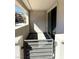 Cozy covered patio featuring gray pavers, stucco walls, and a sliding door offering seamless indoor-outdoor flow at 11423 Ethereal Landing Ave, Las Vegas, NV 89138