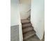 Carpeted staircase with white railing and tiled landing at 11423 Ethereal Landing Ave, Las Vegas, NV 89138