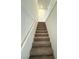 View looking up carpeted staircase with a white handrail at 11423 Ethereal Landing Ave, Las Vegas, NV 89138