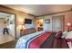 Comfortable bedroom featuring a TV, neutral colors, and a connecting bathroom at 1150 N Buffalo Dr # 1022, Las Vegas, NV 89128