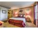 Relaxing bedroom features a king-sized bed, soft carpet, and access to a walk-in closet at 1150 N Buffalo Dr # 1022, Las Vegas, NV 89128