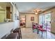 The dining area flows seamlessly into the kitchen and features a dining table set for four at 1150 N Buffalo Dr # 1022, Las Vegas, NV 89128