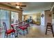 The dining room features a modern glass table, red chairs, and easy access to the balcony at 1150 N Buffalo Dr # 1022, Las Vegas, NV 89128