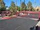 Gated entrance to the community with manicured landscaping and a secure entry system for resident privacy at 1150 N Buffalo Dr # 1022, Las Vegas, NV 89128