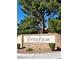 Stone signage marking the entrance to Copper Palms community with lush landscaping, inviting atmosphere at 1150 N Buffalo Dr # 1022, Las Vegas, NV 89128