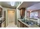 Functional kitchen featuring stainless appliances, granite countertops, and backyard access at 1150 N Buffalo Dr # 1022, Las Vegas, NV 89128