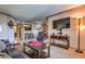 Spacious living room boasting neutral walls, plush carpet, and contemporary furniture at 1150 N Buffalo Dr # 1022, Las Vegas, NV 89128