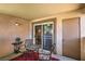 Cozy patio area with a table and chairs, perfect for relaxing outdoors at 1150 N Buffalo Dr # 1022, Las Vegas, NV 89128