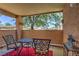 Private patio featuring comfortable seating and serene views of the lush green landscaping at 1150 N Buffalo Dr # 1022, Las Vegas, NV 89128