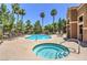 Community pool area with a separate hot tub for relaxation at 1150 N Buffalo Dr # 1022, Las Vegas, NV 89128